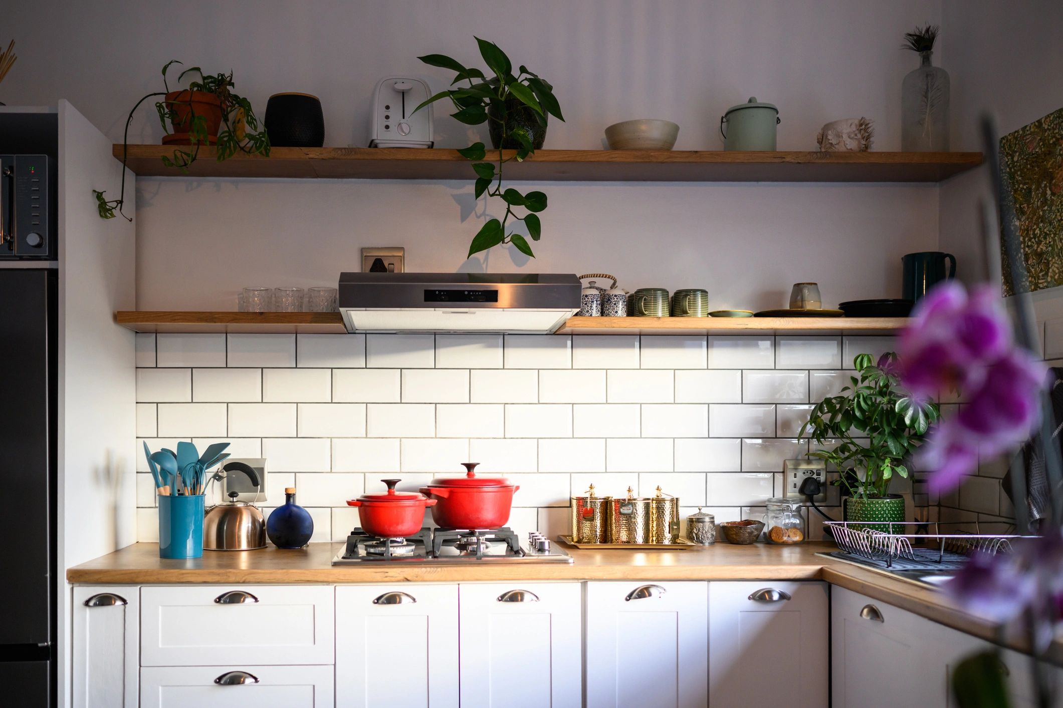 White kitchen cabinets with subway tile backsplash