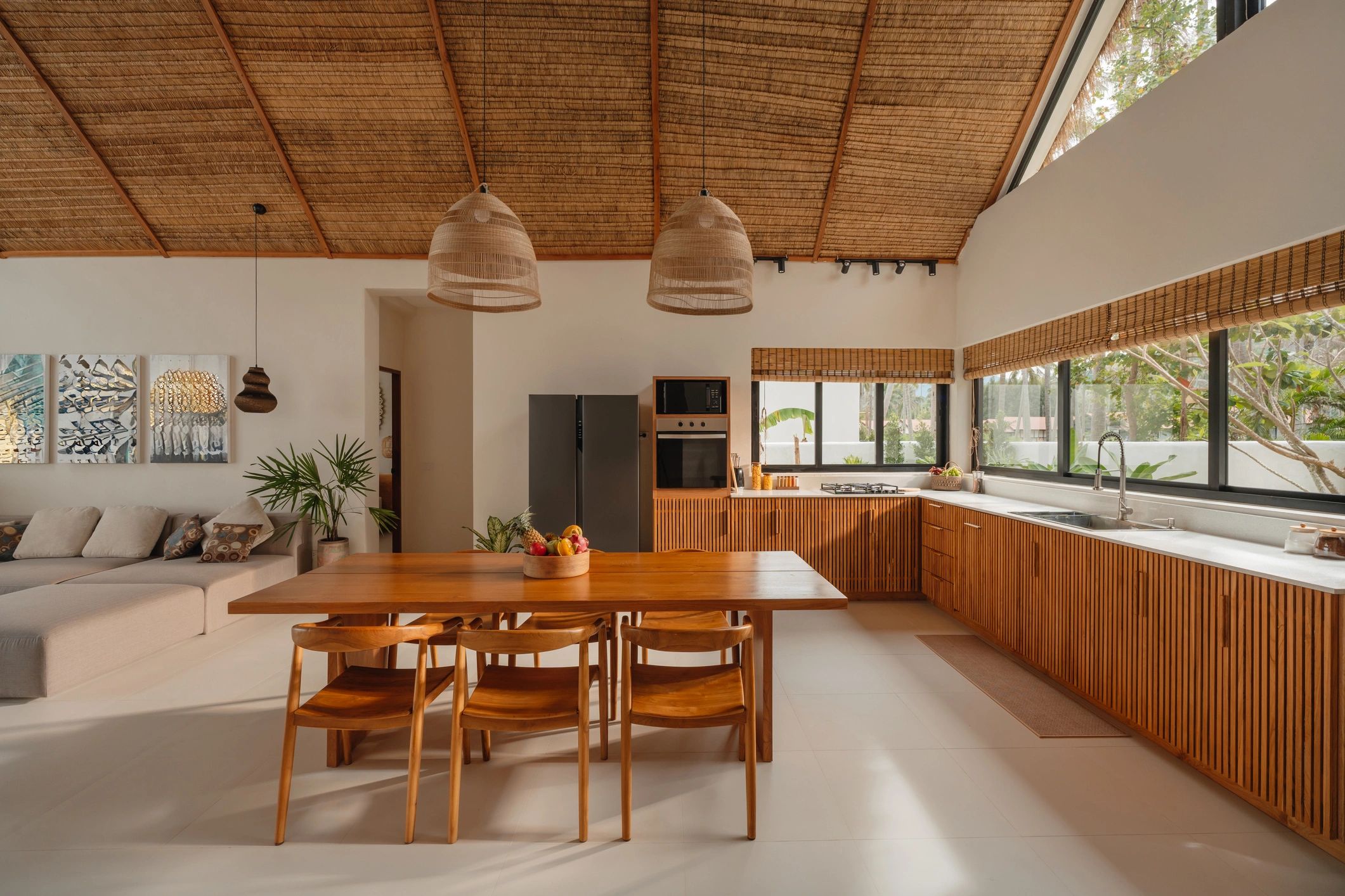Modern kitchen with warm wood cabinets and dining area