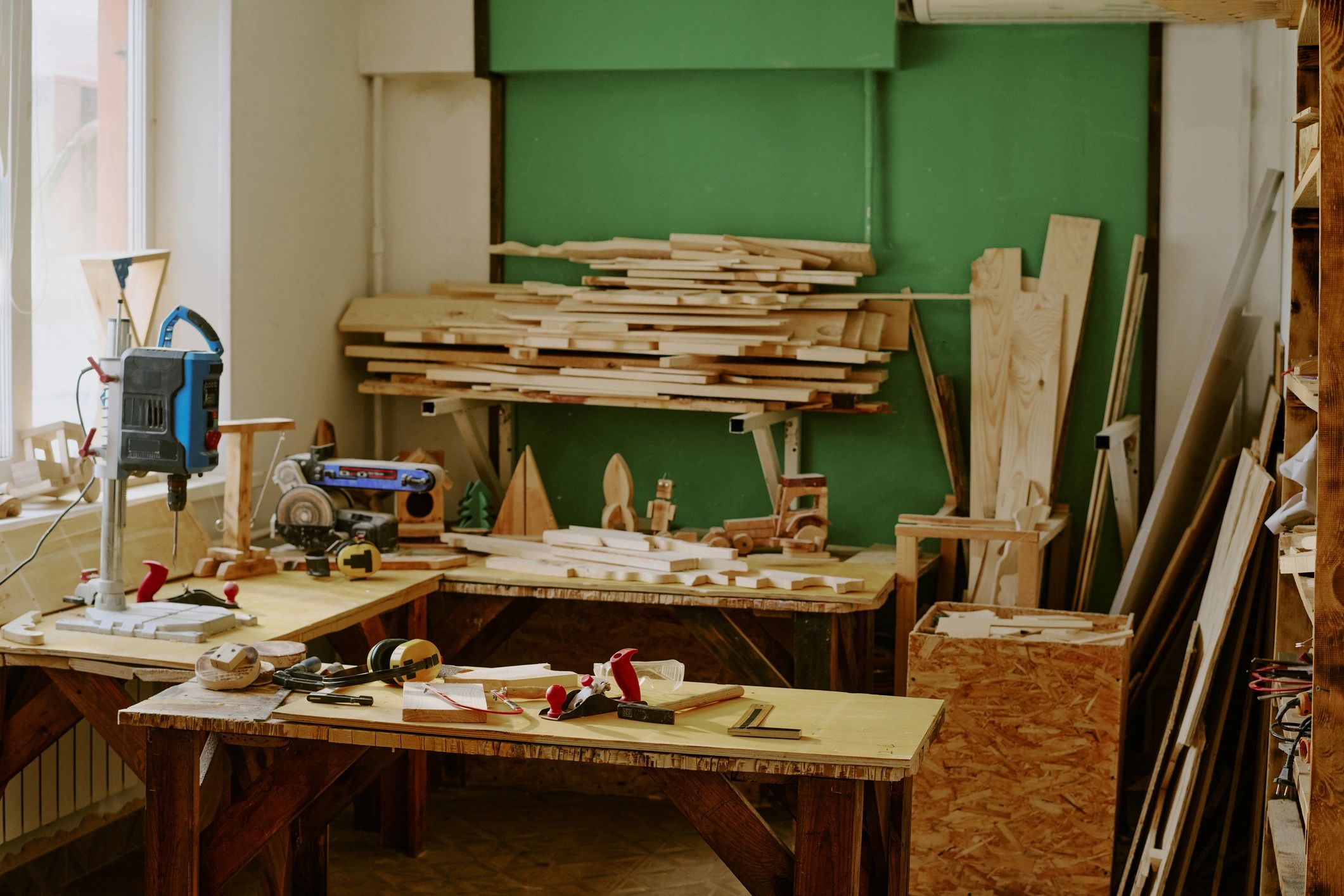 Woodworking workshop with lumber storage and carpentry tools